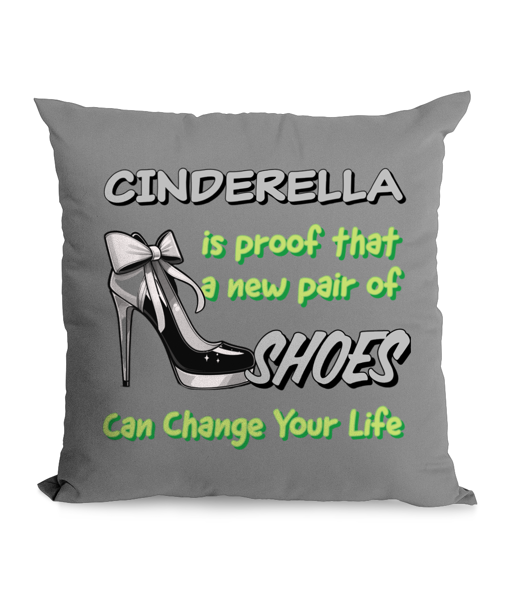  

“Black canvas cushion with high heel illustration and the text ‘Cinderella is proof a new pair of shoes can change your life’ in bold green and white.”