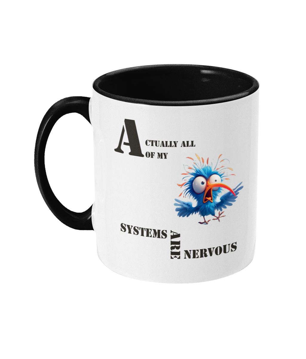 A white ceramic coffee mug with a black interior and handle, featuring humorous text that reads, “Actually, all of my systems are nervous.” The design includes a comical illustration of a wide-eyed, frazzled blue bird with spiky feathers, adding a playful and quirky touch.