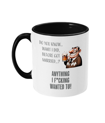 A white ceramic coffee mug with a black interior and handle. The mug displays the cheeky text, “Do you know what I did before I got married? Anything I f*cking wanted to!” paired with a cartoon illustration of a cheerful older man holding a beer mug. The text uses playful fonts, emphasizing the humorous tone.