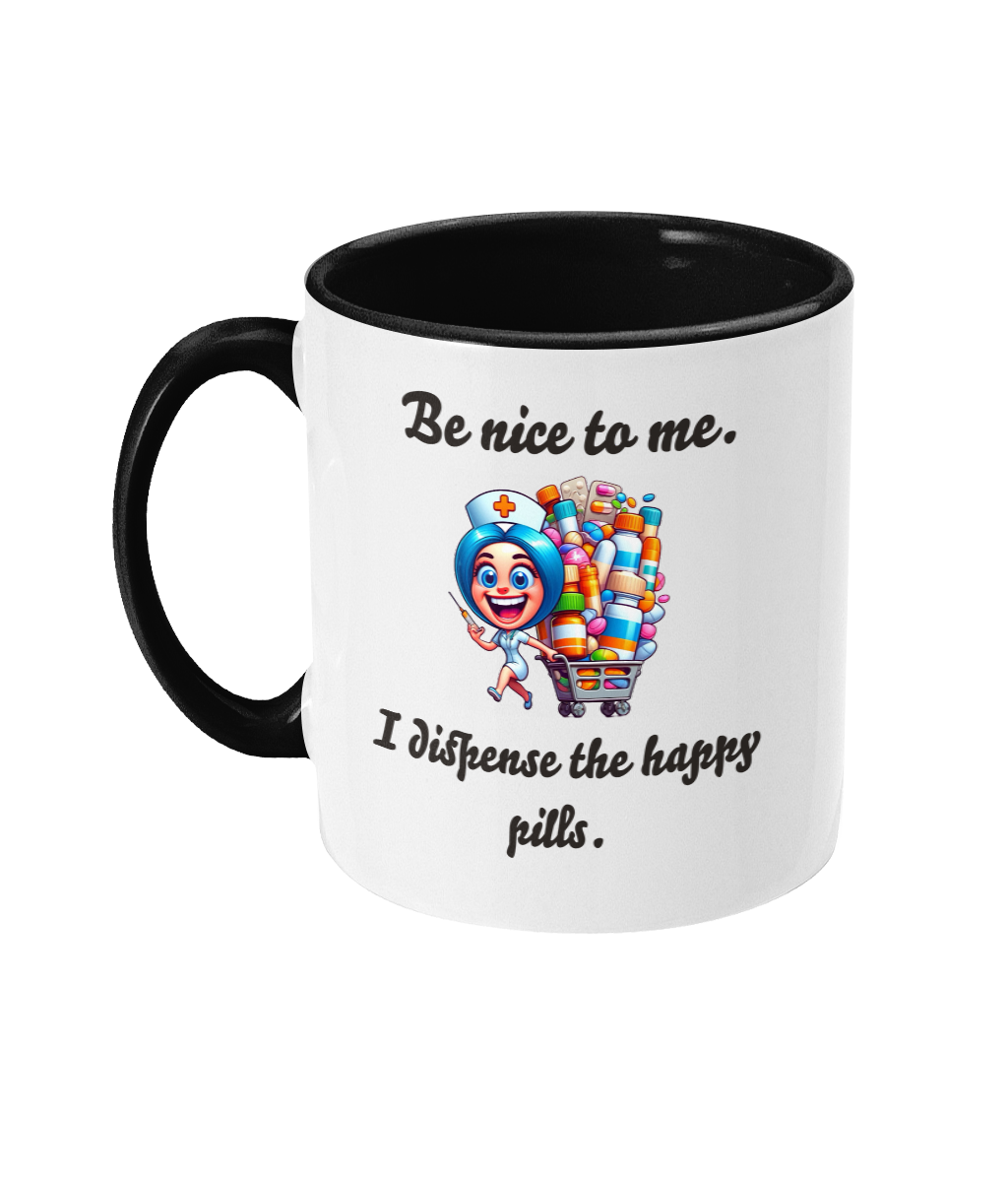 A white ceramic coffee mug with a black interior and handle, featuring the humorous text, “Be nice to me. I dispense the happy pills.” The design includes a colorful cartoon illustration of a cheerful nurse holding a syringe and standing next to a cart overflowing with colorful pill bottles, adding a playful and lighthearted touch.