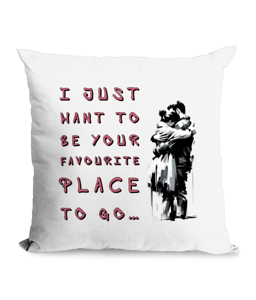 Black cushion with a couple embracing and the text: ‘I just want to be your favorite place to go.’”