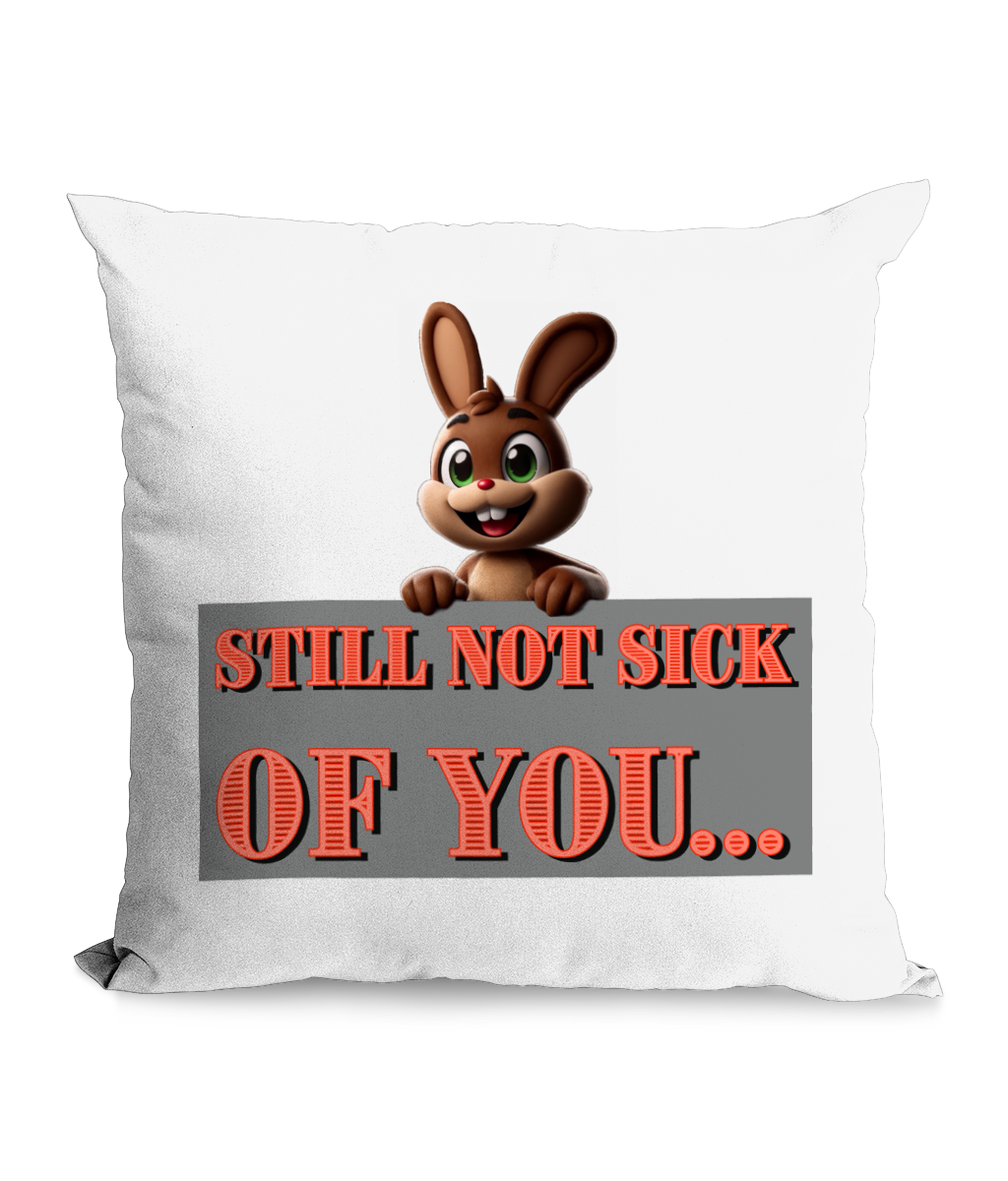 Black cushion with a cute cartoon bunny and the quote ‘Still Not Sick of You’ in bold red letters.”