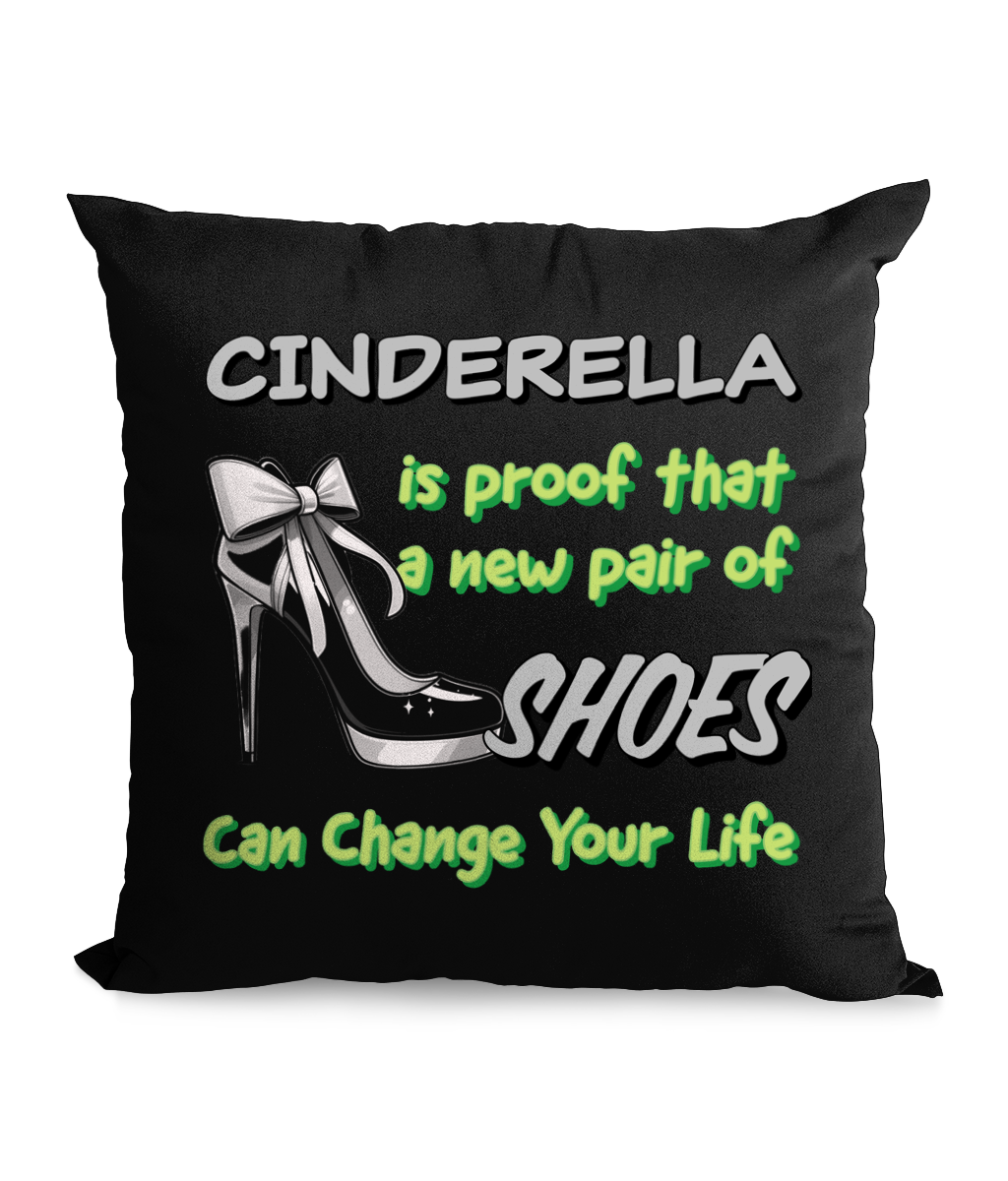  

“Black canvas cushion with high heel illustration and the text ‘Cinderella is proof a new pair of shoes can change your life’ in bold green and white.”